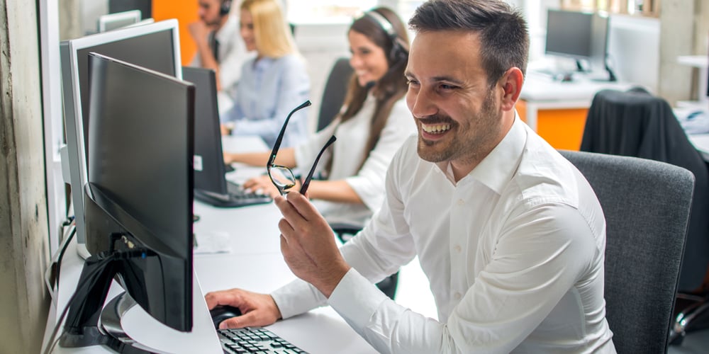 Smiling man at desk